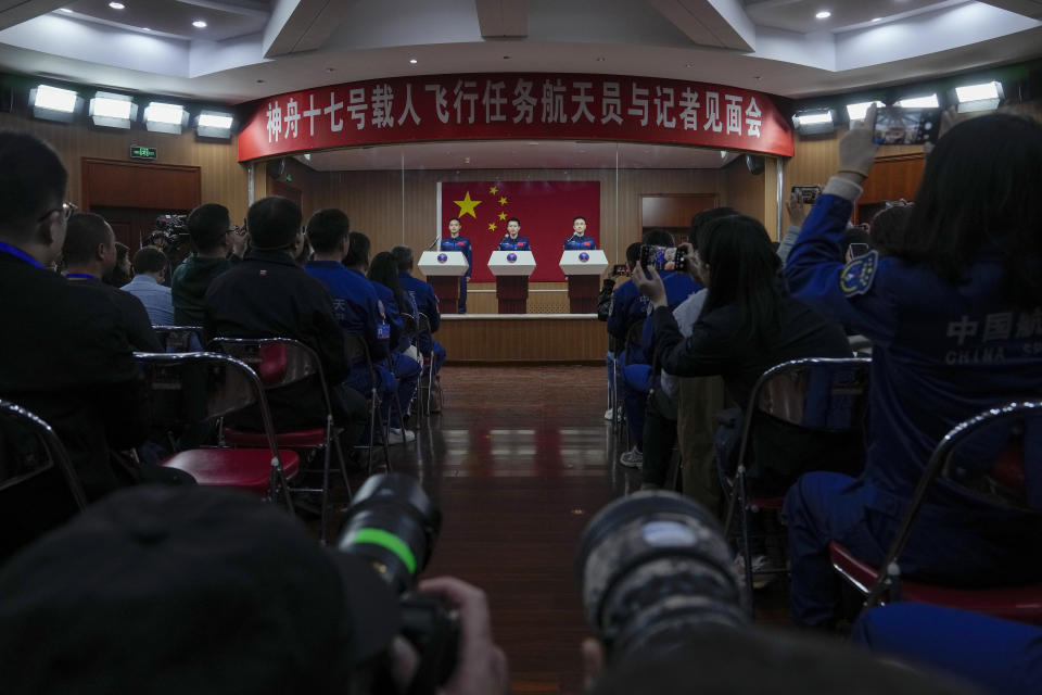Chinese astronauts for the upcoming Shenzhou-17 mission, from left, Jiang Xinlin, Tang Hongbo and Tang Shengjie arrive for a meeting with the press at the Jiuquan Satellite Launch Center in northwest China, Wednesday, Oct. 25, 2023. (AP Photo/Andy Wong)