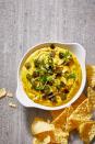 <p>Made with cashews, this unbelievable vegan queso has the same rich, creamy texture you'd get from cheese.</p><p>Get the <a href="https://www.goodhousekeeping.com/food-recipes/a29686013/vegan-queso-dip-recipe/" rel="nofollow noopener" target="_blank" data-ylk="slk:Vegan Queso recipe;elm:context_link;itc:0;sec:content-canvas" class="link "><strong>Vegan Queso recipe</strong></a>. </p>