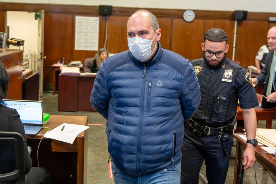 Company president Alexander Shaporov is pictured being escorted out of a courtroom in Manhattan. Steven Hirsch