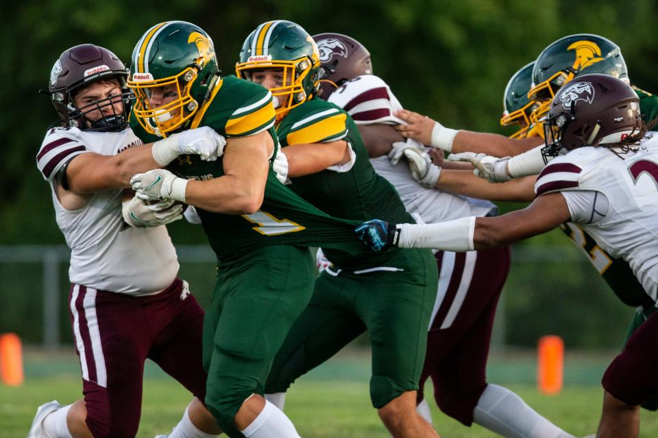 Saint Mark's Spartans wide receiver Paoli Massimo (1) holds on to the ball against the Appoquinimink Jaguars defense during the season opening high school football game at Saint Mark's in Wilmington, Friday, Sept. 2, 2022. Saint Mark's defeated Appoquinimink 20-16.