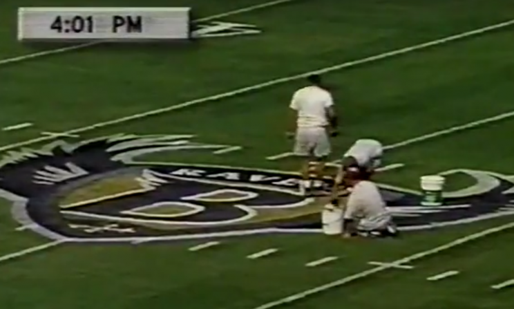 Workers put on the finishing touches before an exhibition game against the Eagles. 