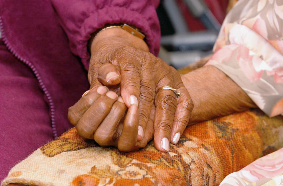 <p> FILE - In this April 1, 2005 file photo, an 81-year-old woman holds the hand of her 100-year-old mother in Tuscaloosa, Ala. A survey conducted in late 2016 finds many pessimistic feelings held by people earlier in life take an optimistic turn as they move toward old age. Even hallmark concerns of old age _ about declining health, lack of independence and memory loss _ lessen as Americans age. (Dan Lopez/The Tuscaloosa News via AP) </p>