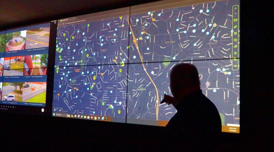 Lt. Andy Farmer, who oversees the Columbus Police Department’s Real Time Crime Center, looks over a map that shows a variety of information, including the location of home surveillance cameras Columbus residents have registered with the department through the Connect Columbus program. 07/02/2023