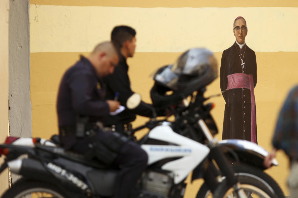 Salvadoran police officers patrol near the Metropolitan Cathedral before the arrival of California Gov. Gavin Newsom in San Salvador, El Salvador, Sunday, April 7, 2019. Newsom visited the tomb of Archbishop Romero, the Salvadoran priest assassinated in 1980 due to his advocacy for human rights and the poor. (AP Photo/Salvador Melendez)