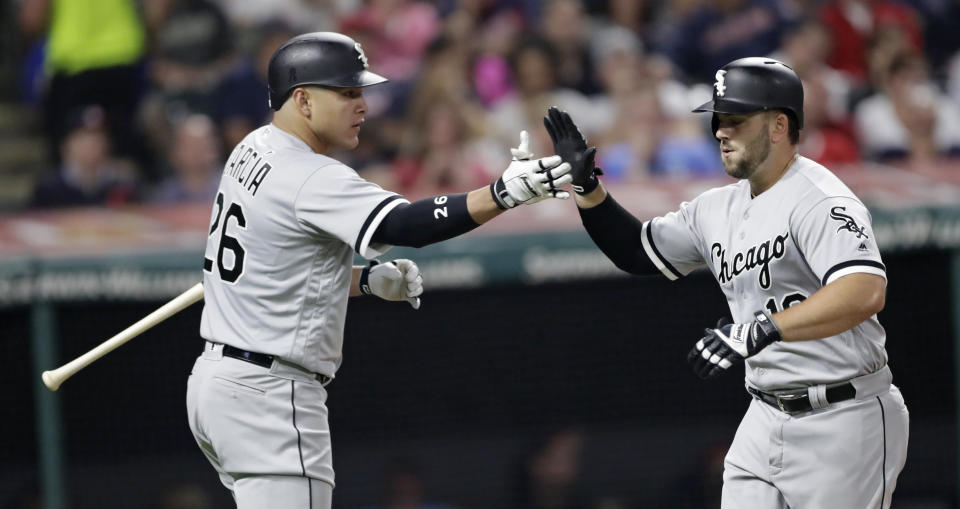 Chicago White Sox's Daniel Palka, right, is congratulated by Avisail Garcia after Palka hit a solo home run in the sixth inning of a baseball game against the Cleveland Indians, Wednesday, Sept. 19, 2018, in Cleveland. (AP Photo/Tony Dejak)