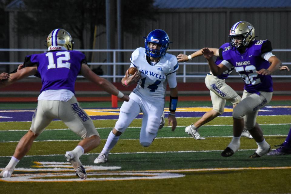 Farwell's Alec Actkinson (14) splits two Panhandle defenders in the Panthers' 36-35 win over the Steers on Friday, Oct. 29, 2021 at Panther Stadium.