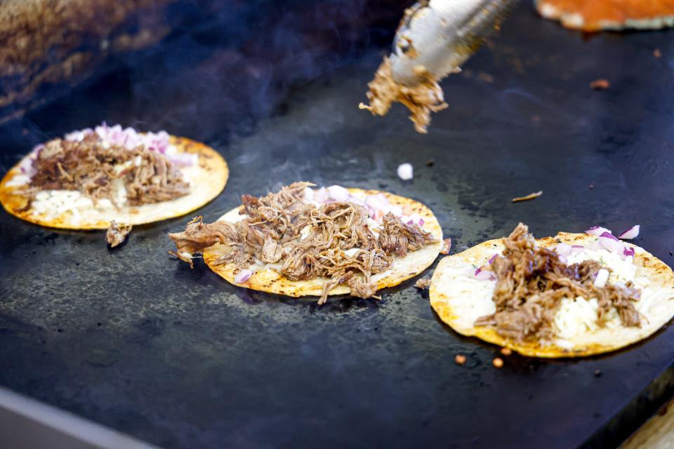 Tacos are made on the grill at Taco Empire in Oklahoma City.