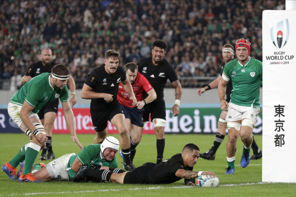 New Zealand's Aaron Smith scores a try during the Rugby World Cup quarterfinal match at Tokyo Stadium between New Zealand and Ireland in Tokyo, Japan, Saturday, Oct. 19, 2019. (AP Photo/Mark Baker)