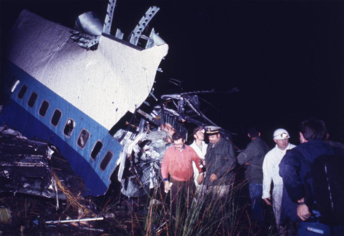 Rescuers look for survivors near a section of fuselage of an Eastern Airlines plane that crashed in the Everglades in December 1972.