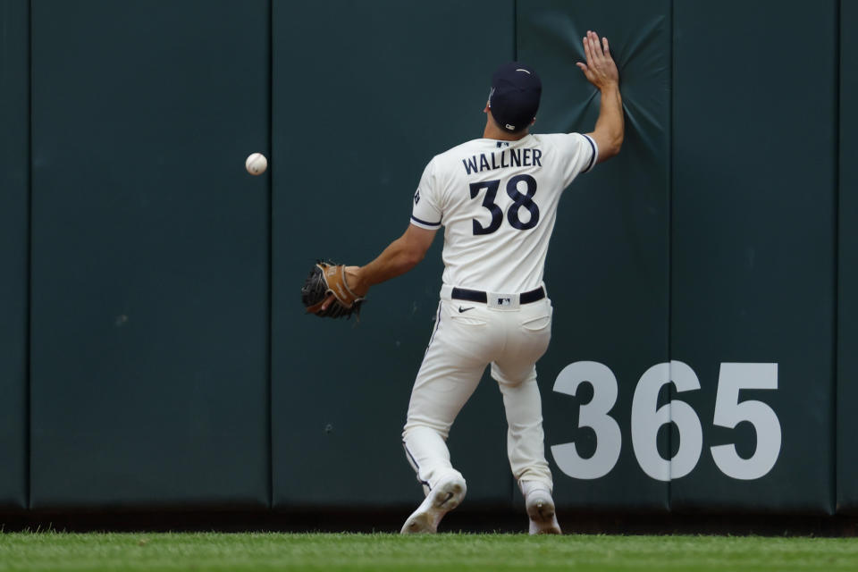 Minnesota Twins right fielder Matt Wallner chases down a double off the wall by Pittsburgh Pirates' Bryan Reynolds to end a perfect baseball game in the seventh inning Sunday, Aug. 20, 2023, in Minneapolis. (AP Photo/Bruce Kluckhohn)