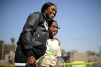 U.S. Open Champion Sloane Stephens (L) teaches tennis to 400 elementary students at a workshop in Compton, California, U.S. April 12, 2018. REUTERS/Lucy Nicholson