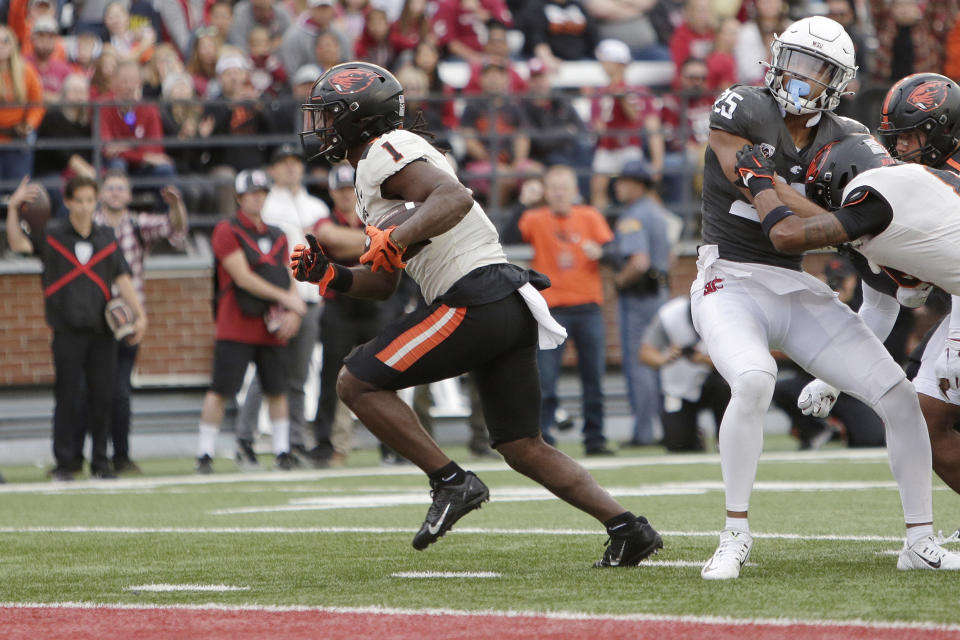 Oregon State running back Deshaun Fenwick (1) runs for a touchdown during the first half of an NCAA college football game against Washington State, Saturday, Sept. 23, 2023, in Pullman, Wash. (AP Photo/Young Kwak)