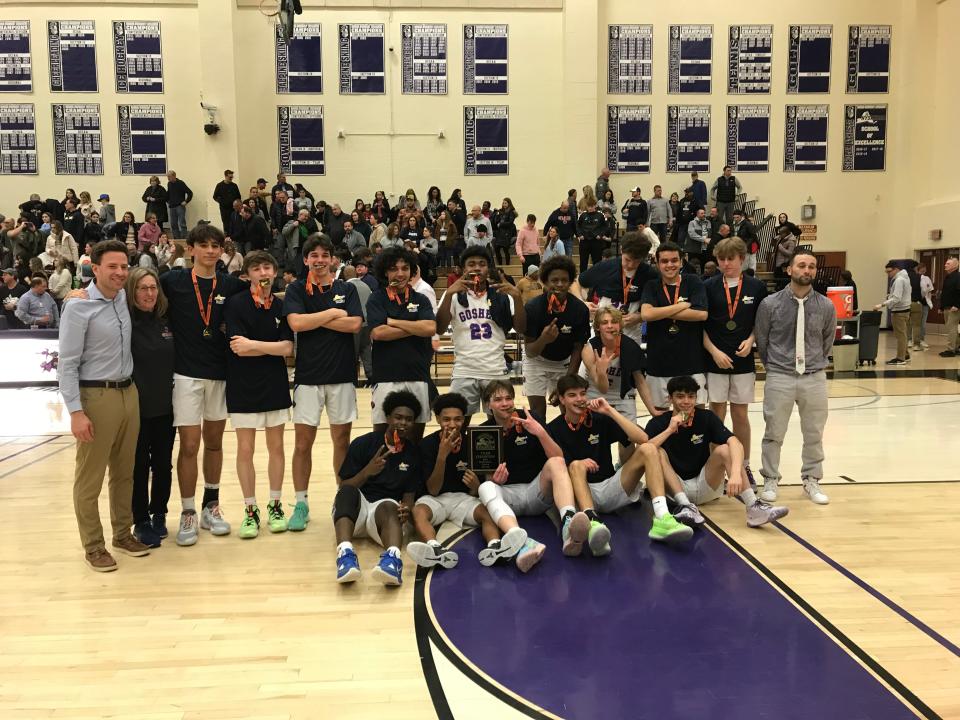 Goshen players and staff pose with their championship medals following a win over Our Lady of Lourdes in the Section 9 Class A title game. KEN McMILLAN/Times Herald-Record