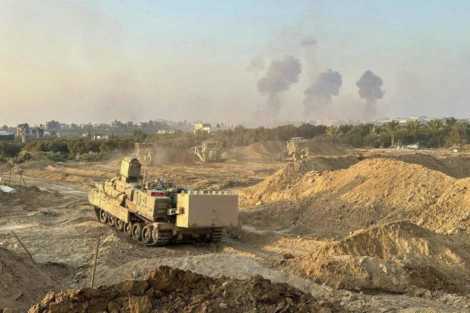  Israeli tanks and armored bulldozers breached the security fence around Gaza in multiple locations. (Israel Defense Forces via AP)