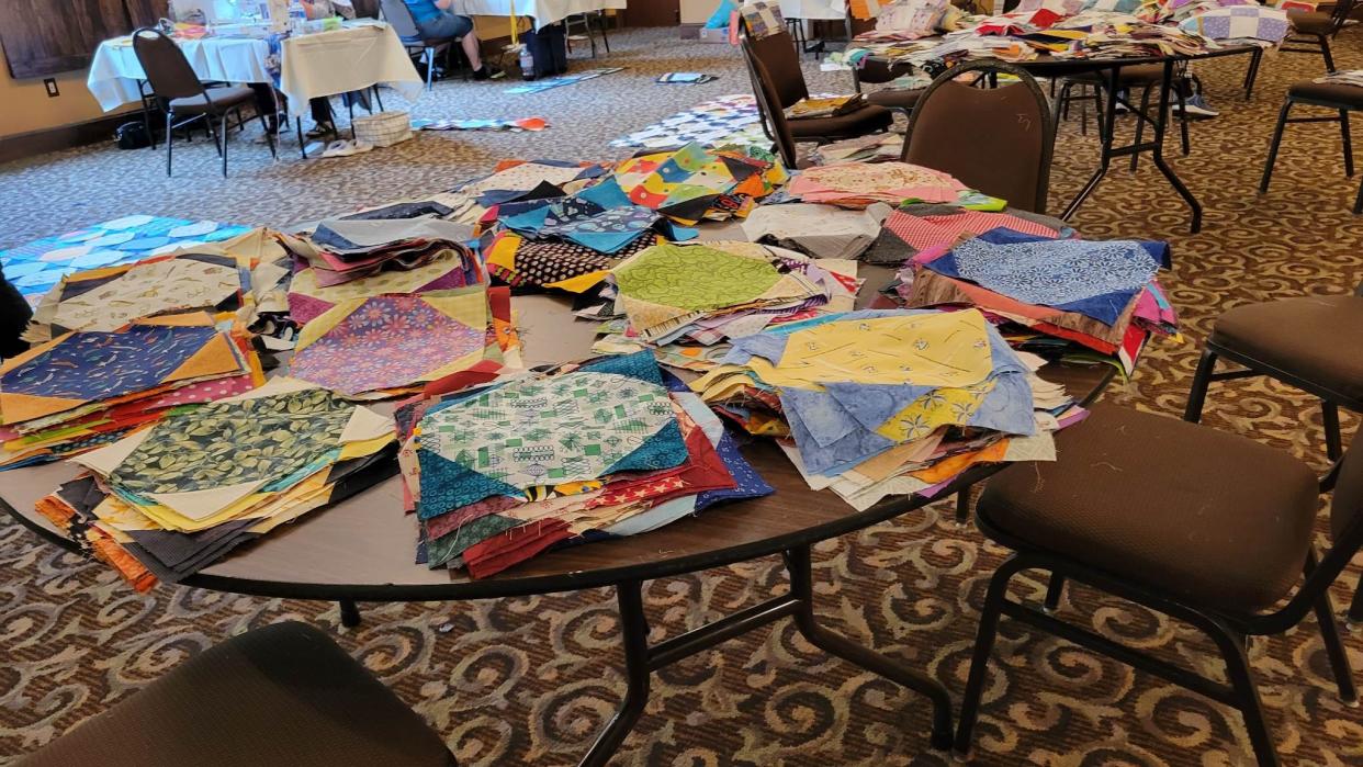 Patches of future quilts sit on a table during the Sunshine Quilt Guild Retreat on April 25 at The Lodge at Flat Rock.