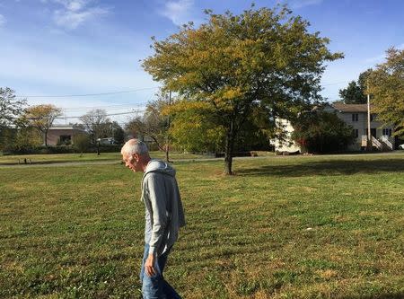 Frank Lettieri visits the patch of grass that used to be the house where he and his wife Mary raised their five children in Oakwood Beach neighborhood in Staten Island, New York October 23, 2017. REUTERS/Peter Szekely