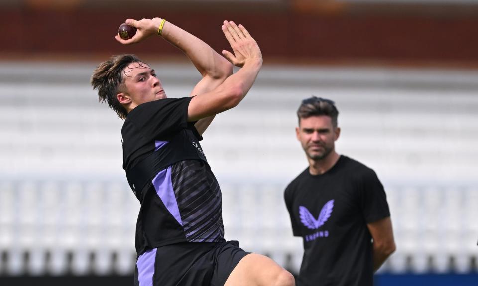 <span>Josh Hull in bowling action under the watchful eye of mentor Jimmy Anderson during nets.</span><span>Photograph: Stu Forster/Getty Images</span>