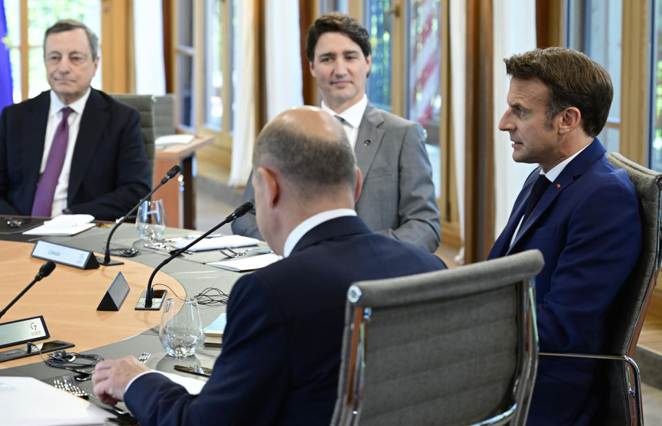 Clockwise from left, Mario Draghi, Prime Minister of Italy, Justin Trudeau, Prime Minister of Canada, Emmanuel Macron, Prime Minister of France and German Chancellor Olaf Scholz sit at the first working session in Castle Elmau in Kruen, near Garmisch-Partenkirchen, Germany, on Sunday, June 26, 2022. The Group of Seven leading economic powers are meeting in Germany for their annual gathering Sunday through Tuesday. (John MacDougall/Pool Photo via AP)