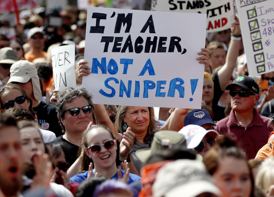 <p>People participate in the March For Our Lives rally at the Capitol Saturday, March 24, 2018, in Phoenix, Arizona. (AP Photo/Matt York) </p>