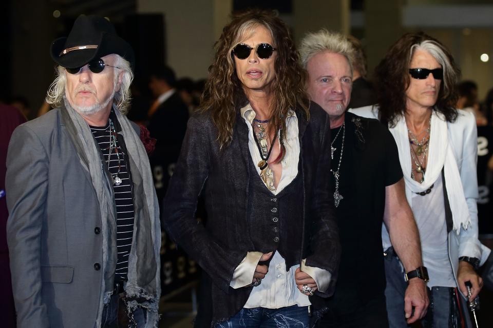 SINGAPORE - MAY 23: (L-R) Tom Hamilton, Steven Tyler, Joey Kramer and Joe Perry of American rock band Aerosmith walk the red carpet  during the Social Star Awards 2013 at Marina Bay Sands on May 23, 2013 in Singapore.  (Photo by Suhaimi Abdullah/Getty Images)