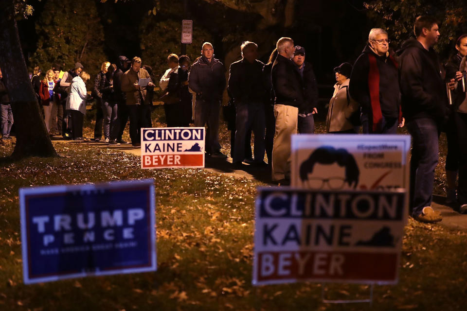 Voters wait in-line for casting their ballots outside a polling place on Election Day in Alexandria, Virginia, on Nov. 8.
