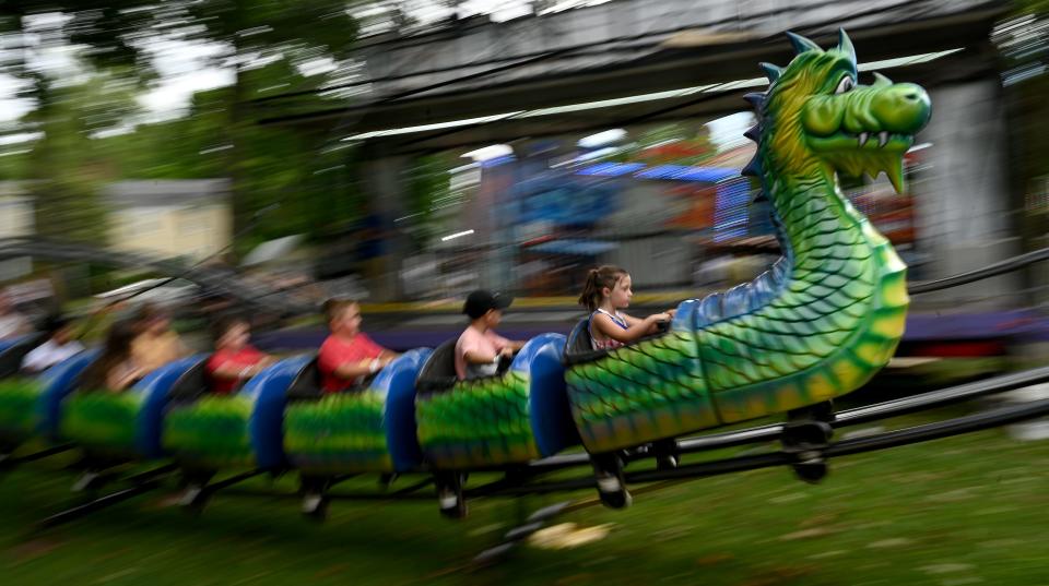 Children enjoy the Dragon Wheel ride during Franklin's Fourth of July festivities on Franklin Town Common, July 2, 2022.