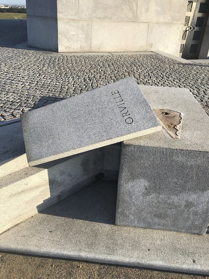 The National Park Service says a copper bust of aviation pioneer Orville Wright has been stolen from the Wright Brothers National Memorial in the Outer Banks of North Carolina. The Park Service and local law enforcement officials are investigating the case and are asking the public for any information. The agency in a statement says the monument was damaged either Saturday evening, Oct. 12, 2019 or Sunday morning. The granite base that the bust was mounted to was toppled and damaged. (The National Park Service via AP)