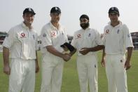 <p>Cook made his debut in England’s first Test of the 2006 tour to India. Pictured here receiving his cap alongside Monty Panesar (second right) and Ian Blackwell (left) after a last minute dash from the Caribbean to Nagpur (Getty Images) </p>