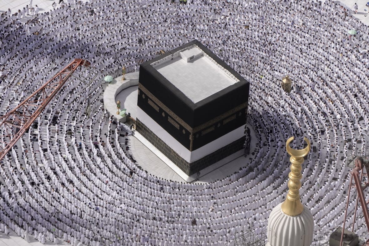 Muslim pilgrims pray around the Kaaba, the cubic building at the Grand Mosque, during the annual Hajj pilgrimage in Mecca, Saudi Arabia, Sunday, June 25, 2023. (AP Photo/Amr Nabil)