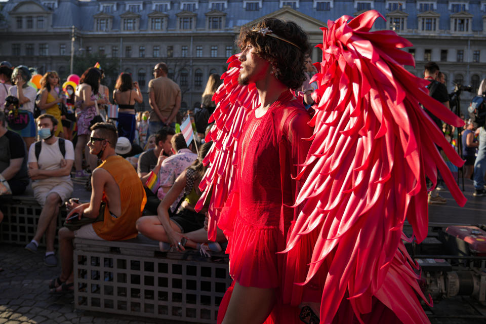 A person wears a red outfit during the Bucharest Pride 2021 in Bucharest, Romania, Saturday, Aug. 14, 2021. The 20th anniversary of the abolishment of Article 200, which authorized prison sentences of up to five years for same-sex relations, was one cause for celebration during the gay pride parade and festival held in Romania's capital this month. People danced, waved rainbow flags and watched performances at Bucharest Pride 2021, an event that would have been unimaginable a generation earlier. (AP Photo/Vadim Ghirda)