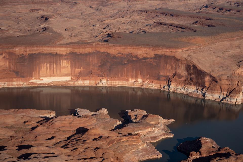 Lake Powell as seen on June 11, 2022. White mineral deposits mark the water’s former elevation.