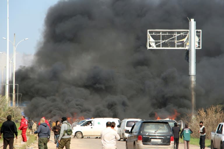 Smoke billows from the site of a suicide car bombing in Rashidin, west of Aleppo, that targeted buses carrying Syrian evacuees on April 15, 2017