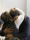 Former Dallas Cowboys NFL football player Josh Brent gets a hug from family after closing arguments in his intoxication manslaughter trial Tuesday, Jan. 21, 2014, in Dallas. The jury has begun deliberating in Brent's intoxication manslaughter trial after lawyers wrapped up their closing arguments Tuesday morning. Prosecutors accuse the former defensive tackle of drunkenly crashing his Mercedes near Dallas during a night out in December 2012, killing his good friend and teammate, Jerry Brown. (AP Photo/LM Otero)