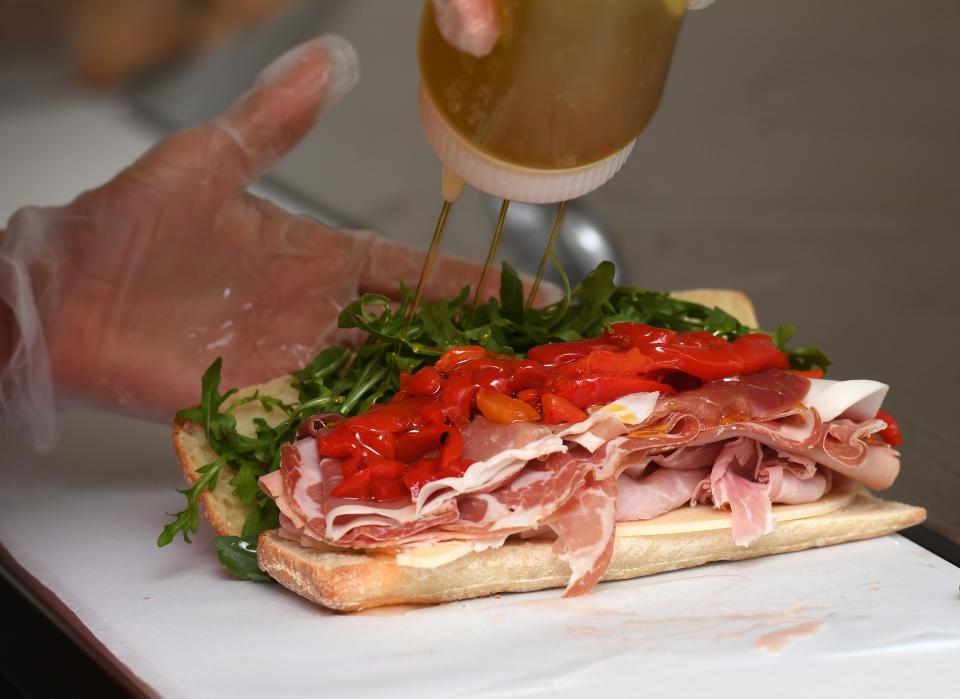 Biazzo Deli is a new Italian sandwich shop in downtown Landrum. This is the 'Nonno' sandwich which is made of Prosciutto Italiano, Coppa, Toscano, Salami, Mortadella, Prosciutto Cotto, Provolone, roasted peppers, Arugula, with oil and vinegar on request. 