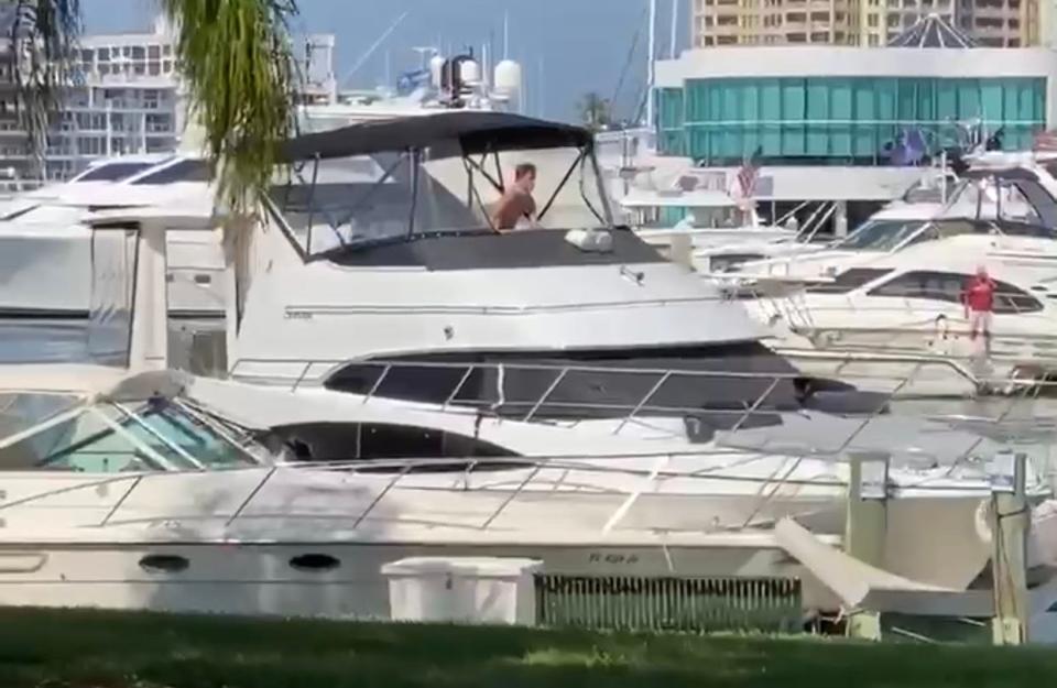 A man piloting a Carver Yacht crashes into a row of boats and a dock on Saturday, Oct. 17, 2020, at Bayfront Park in Sarasota, Florida.