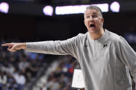 Purdue head coach Matt Painter points in the first half of an NCAA college basketball game against North Carolina, Saturday, Nov. 20, 2021, in Uncasville, Conn. (AP Photo/Jessica Hill)