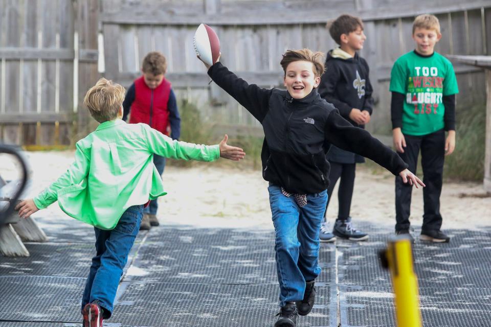 Kids play football during a past Santa Drop at the Flora-Bama Lounge, Package and Oyster Bar. This year's event gets underway on Saturday.