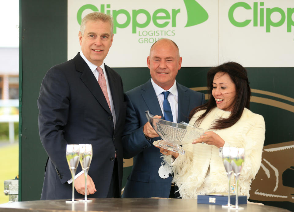 The Duke of York Prince Andrew presents a trophy to winners 