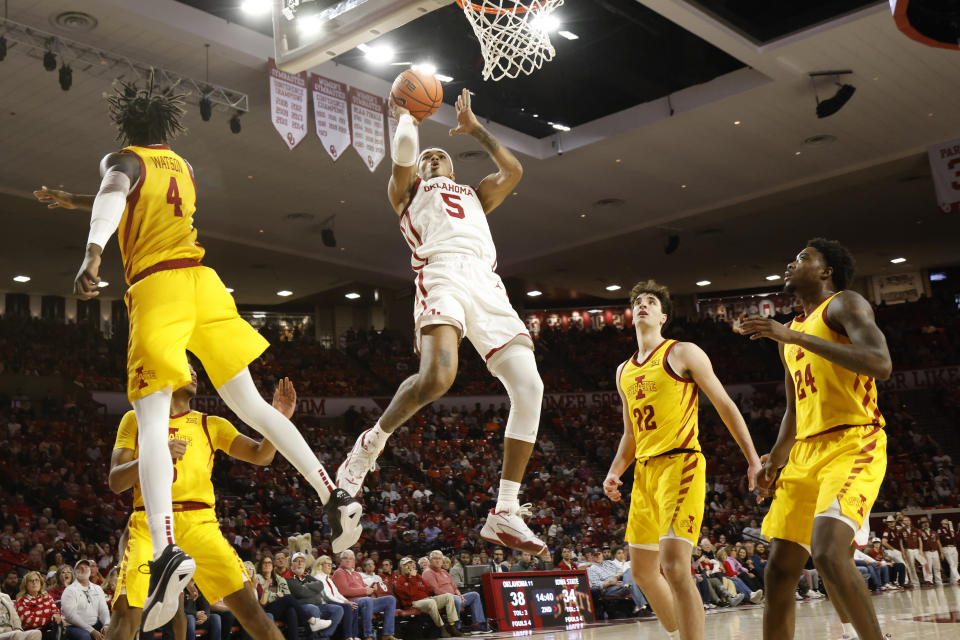 Oklahoma guard Rivaldo Soares (5) prepares to shoot near Iowa State guard Demarion Watson (4), forward Milan Momcilovic (22), and forward Hason Ward (24) during the second half of an NCAA college basketball game Saturday, Jan. 6, 2024, in Norman, Okla. (AP Photo/Nate Billings)