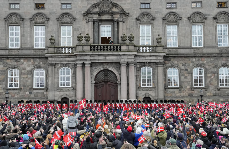 Denmark's King Frederik X waves from the balcony of Christiansborg Palace in Copenhagen, Denmark, Sunday, Jan. 14, 2024. Queen Margrethe II has become Denmark¥s first monarch to abdicate in nearly 900 years when she handed over the throne to her son, who has become King Frederik X. (AP Photo/Martin Meissner)