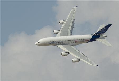 An Airbus A380, the world's largest passenger jet, flies during the Dubai Airshow November 18, 2013. REUTERS/Caren Firouz