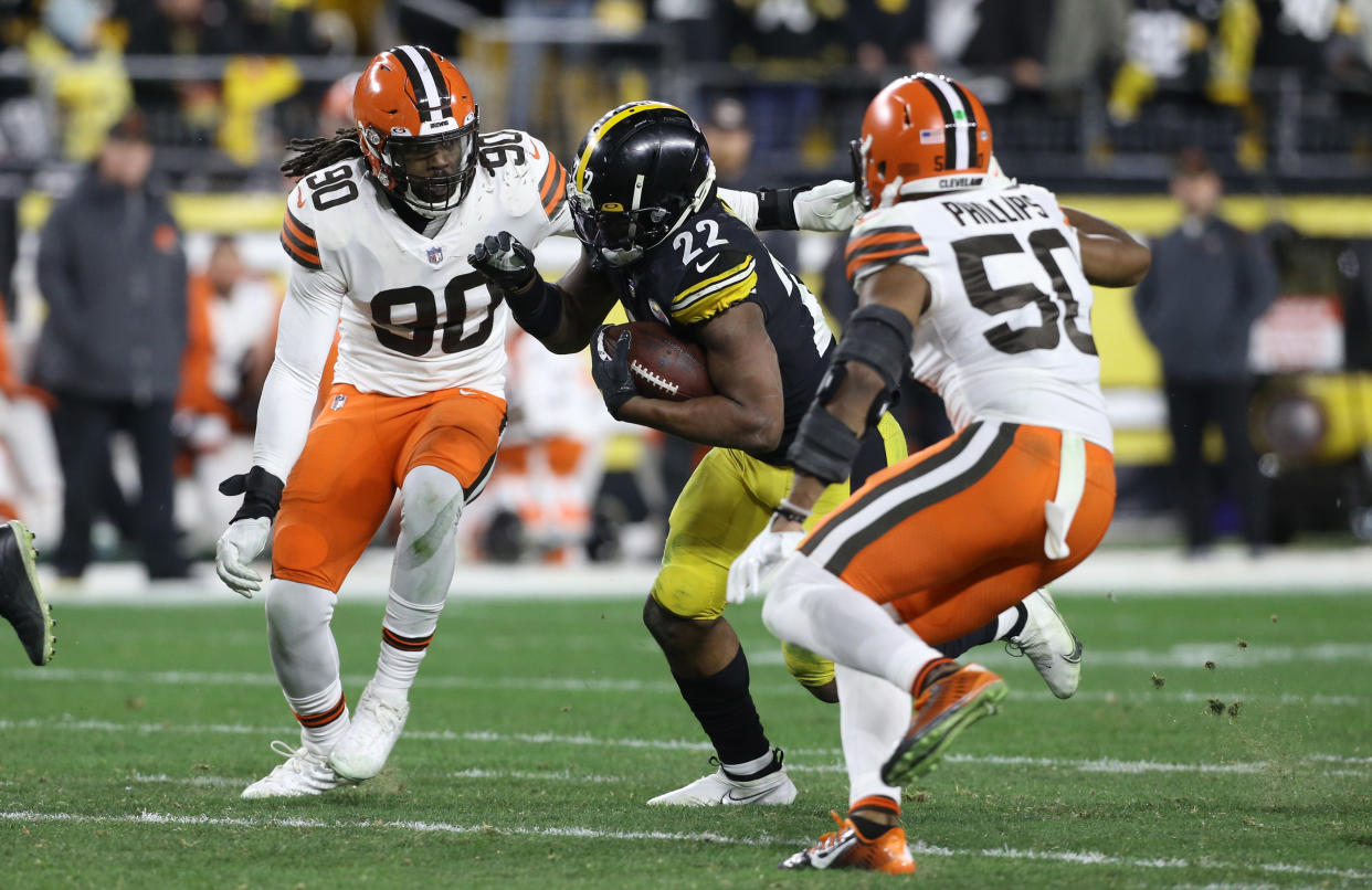 Jan 3, 2022; Pittsburgh, Pennsylvania, USA;  Pittsburgh Steelers running back Najee Harris (22) runs the ball against Cleveland Browns defensive end Jadeveon Clowney (90) and linebacker Jacob Phillips (50) during the second quarter at Heinz Field. Mandatory Credit: Charles LeClaire-USA TODAY Sports Amazon Prime