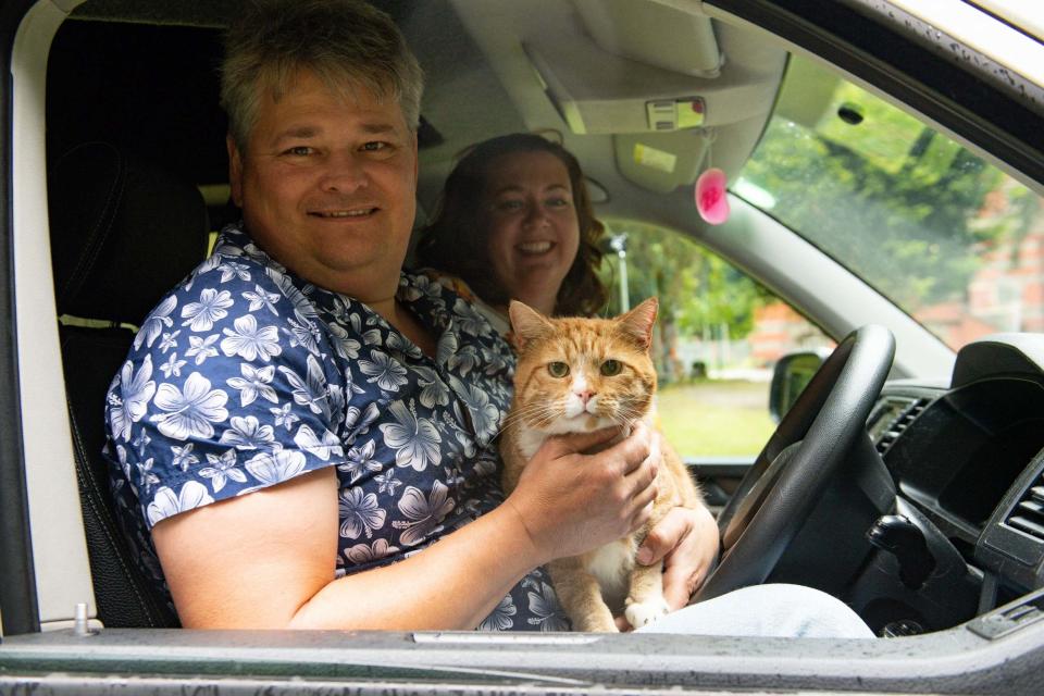 The couple picked up their winning scratchcard while rushing out to buy pet food for their pet cat, Shortcake (PA)