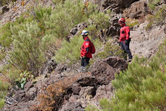 Rescue workers searching for Jay Slater on rocky terrain