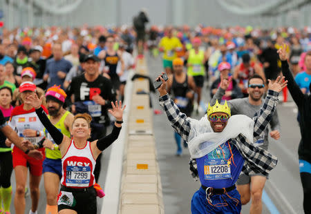 The first wave of runners make their way across the Verrazano-Narrows Bridge during the start of the New York City Marathon in New York, U.S., November 5, 2017. REUTERS/Lucas Jackson