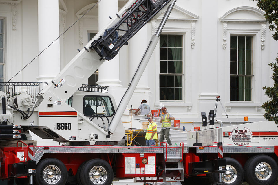 <p>Cranes are positioned in front of the South Portico of the White House in Washington, Friday, Aug. 11, 2017, during renovations while President Donald Trump is spending time at his golf resort in New Jersey. (AP Photo/J. Scott Applewhite) </p>