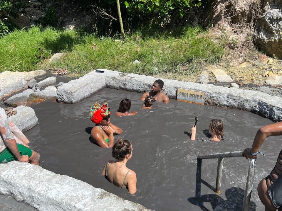 People bathing in a sulfur spring. 