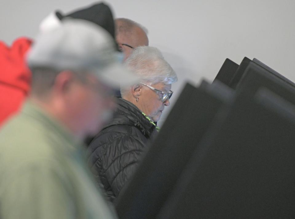 Voters cast their ballots Tuesday morning at Crossroads Community Church in Mansfield.