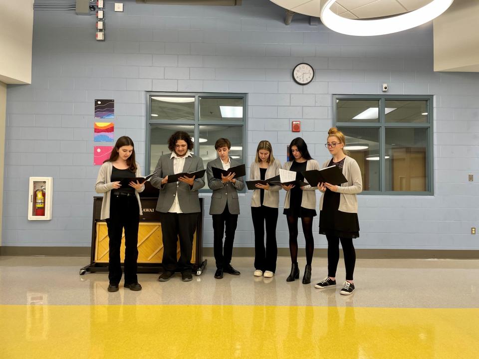 Students from Exeter High School's Music Department sang "Memories" by Maroon 5 as a tribute to William (Bill) Perkins.