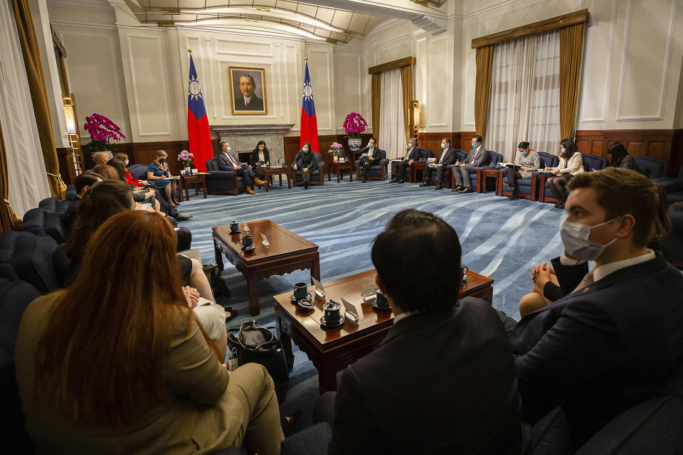 In this photo released by the Taiwan Presidential Office, U.S. Representative Mark Takano, D-Calif. center left chats with Taiwanese President Tsai Ing-wen near other members of the U.S. delegation at the Presidential Office in Taipei, Taiwan on Friday, Nov. 26, 2021. Five U.S. lawmakers met with Taiwan President Tsai Ing-wen Friday morning in a surprise one-day visit intended to reaffirm the United States' "rock solid" support for the self-governing island. (Taiwan Presidential Office via AP)